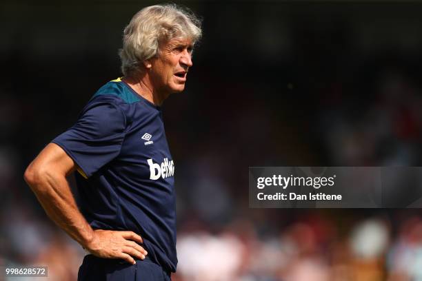 West Ham manager Manuel Pellegrini looks on during the pre-season friendly match between Wycombe Wanderers and West Ham United at Adams Park on July...