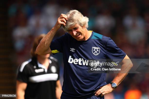 West Ham manager Manuel Pellegrini reacts during the pre-season friendly match between Wycombe Wanderers and West Ham United at Adams Park on July...