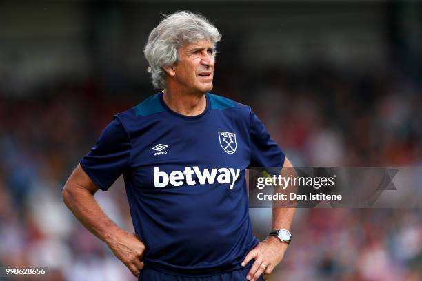 West Ham manager Manuel Pellegrini looks on during the pre-season friendly match between Wycombe Wanderers and West Ham United at Adams Park on July...