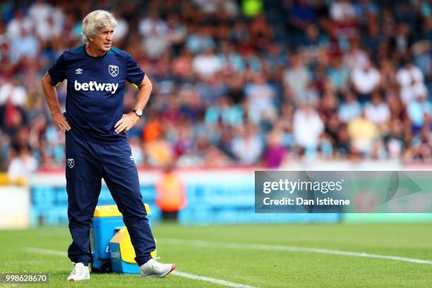 West Ham manager Manuel Pellegrini looks on during the pre-season friendly match between Wycombe Wanderers and West Ham United at Adams Park on July...