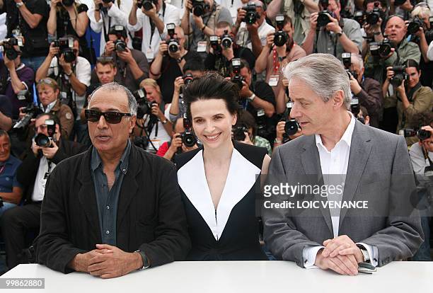 French actress Juliette Binoche , Iranian director Abbas Kiarostami and British actor William Shimell pose during the photocall of "Copie Conforme"...