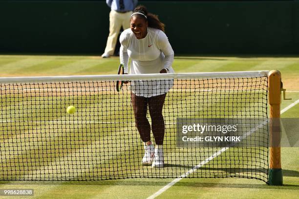 Player Serena Williams celebrates winning a point against Germany's Angelique Kerber during their women's singles final match on the twelfth day of...