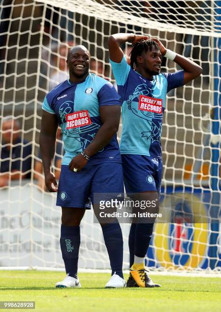 Adebayo Akinfenwa of Wycombe Wanderers and team-mate react after a missed opportunity during the pre-season friendly match between Wycombe Wanderers...