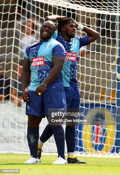 Adebayo Akinfenwa of Wycombe Wanderers and team-mate react after a missed opportunity during the pre-season friendly match between Wycombe Wanderers...