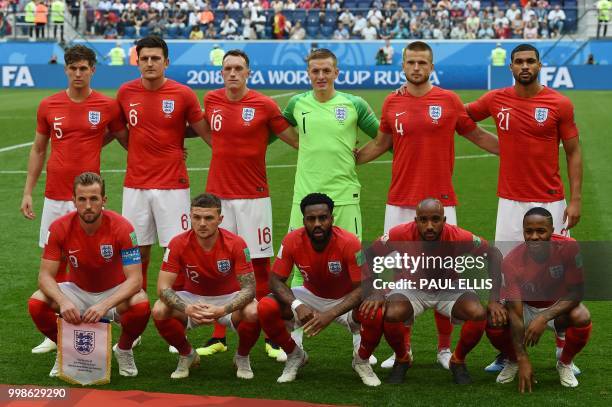 England's defender John Stones, defender Harry Maguire, defender Phil Jones, goalkeeper Jordan Pickford, midfielder Eric Dier, midfielder Ruben...