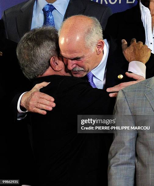 Brazil's President Luiz Ignacio Lula da Silva greets Greek Prime Minister George Papandreou as they gather for the group picture of the Sixth Summit...