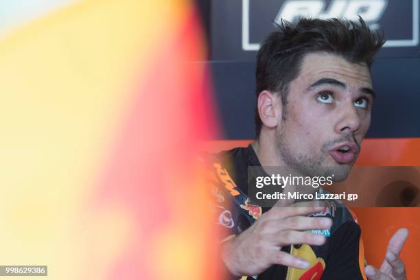 Miguel Oliveira of Portugal and Red Bull KTM Ajo speaks in box during the qualifying practice during the MotoGp of Germany - Qualifying at...