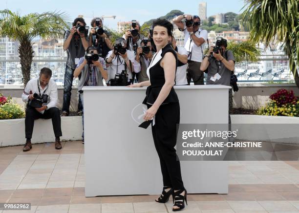 French actress Juliette Binoche poses during the photocall of "Copie Conforme presented in competition at the 63rd Cannes Film Festival on May 18,...