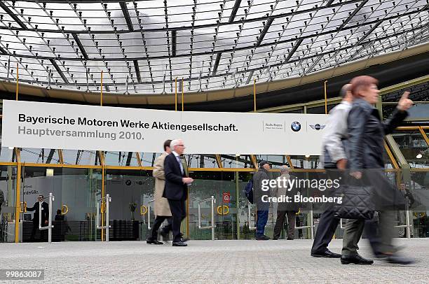 Bayerische Motorenwerke shareholders leave the Olympia Hall, site of the company's annual shareholders' meeting, in Munich, Germany, on Tuesday, May...