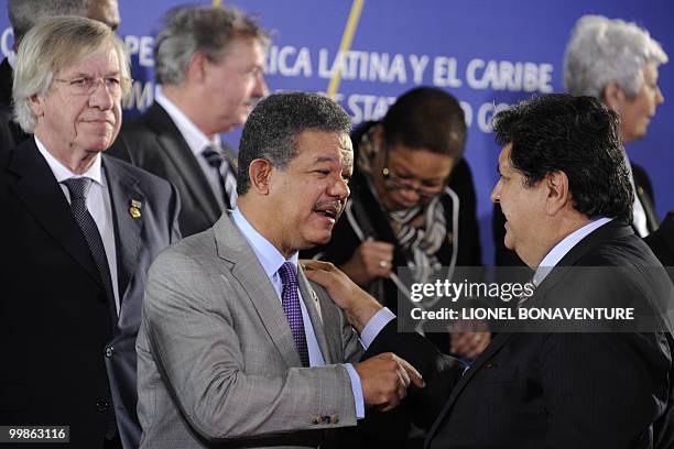 Dominican Republic's President Leonel Fernandez and Peru's President Alan Garcia gather for the group picture of the Sixth Summit of Heads of State...