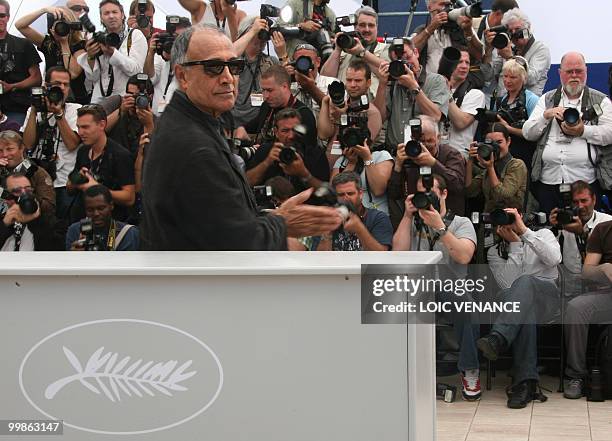 Iranian director Abbas Kiarostami poses during the photocall of "Copie Conforme presented in competition at the 63rd Cannes Film Festival on May 18,...