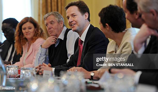 British Deputy Prime Minister, Nick Clegg , reacts during 'the Big Society' meeting, chaired by Prime Minister, David Cameron , in the cabinet room...