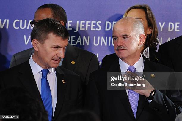 Andrus Ansip, Estonia's prime minister, left, and Georga Papandreou, Greece's prime minister, stand for a group photograph at the European...