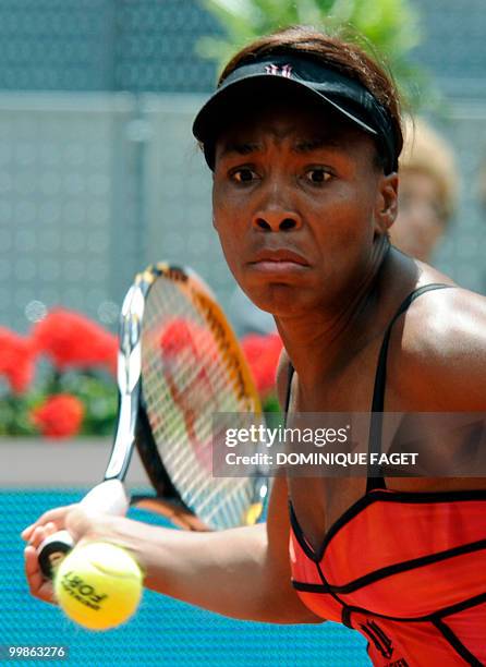 Venus Williams returns the ball to Australian Samantha Stosur during their Madrid Masters tennis match on May 14, 2010 at the Caja Magic sports...