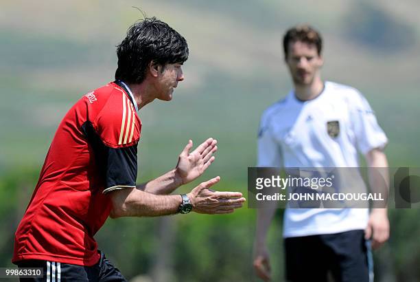 Germany's head coach Joachim Loew and Germany's defender Arne Friedrich take part in a training session at the Verdura Golf and Spa resort, near...
