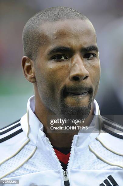 Germany's striker Cacau listens to the national anthems ahead of the friendly football match Germany vs Malta in the western German city of Aachen on...