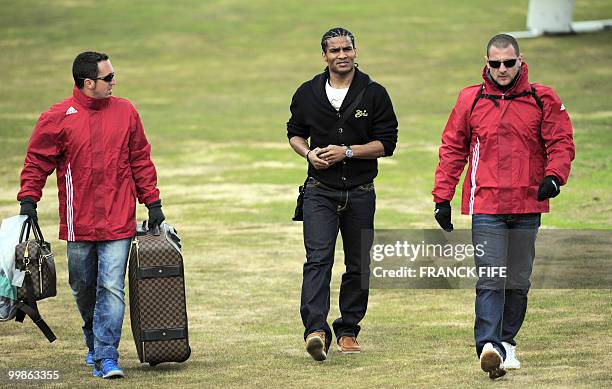 French midfielder Florent Malouda arrives in Tignes, French Alps on May 18, 2010 to join the French national football team which will be starting...