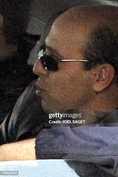 Iranian agent Ali Vakili Rad is seen in a police vehicle while leaving Poissy, a Paris suburb, on May 18, 2010 after his release from the local...