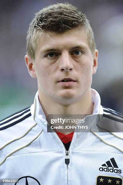 Germany's midfielder Toni Kroos listens to the national anthems ahead of the friendly football match Germany vs Malta in the western German city of...