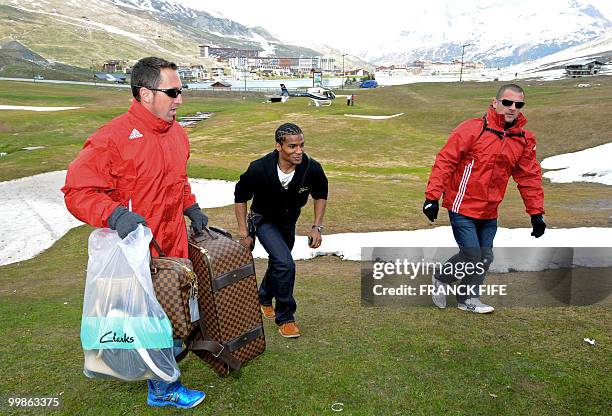 French midfielder Florent Malouda arrives in Tignes, French Alps on May 18, 2010 to join the French national football team which will be starting...