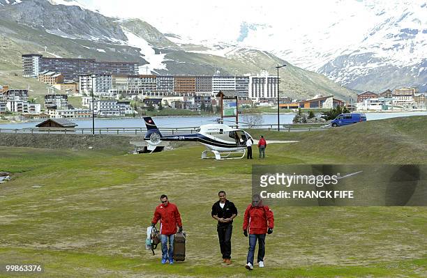 French midfielder Florent Malouda arrives in Tignes, French Alps on May 18, 2010 to join the French national football team which will be starting...