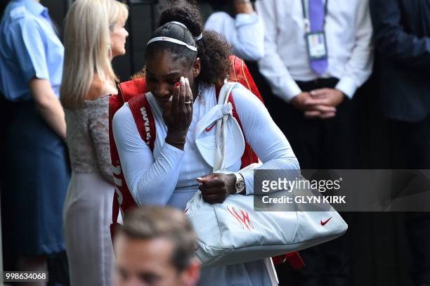 Player Serena Williams leaves the court after losing to Germany's Angelique Kerber during their women's singles final match on the twelfth day of the...