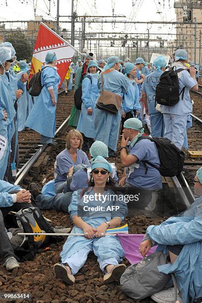 French anaesthetist nurses stand on tracks near the Montparnasse train station on May 18, 2010 in Paris, during a demonstration blocking the speed...