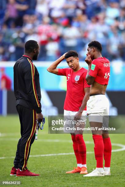 Romelu Lukaku of Belgium talks with Jesse Lingard and Marcus Rashford both of England after the 2018 FIFA World Cup Russia 3rd Place Playoff match...