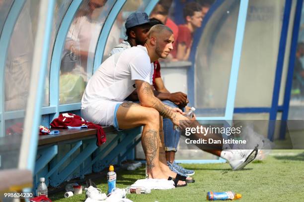 Marko Arnautovic looks on from the bench during the pre-season friendly match between Wycombe Wanderers and West Ham United at Adams Park on July 14,...