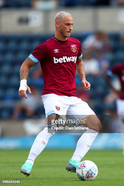 Marko Arnautovic runs with the ball during the pre-season friendly match between Wycombe Wanderers and West Ham United at Adams Park on July 14, 2018...
