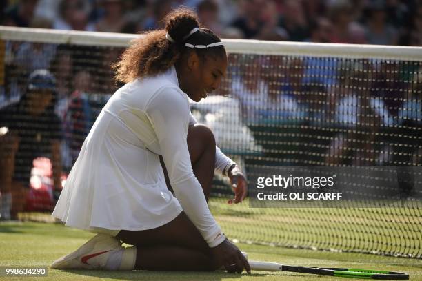 Player Serena Williams reacts after losing a point against against Germany's Angelique Kerber during their women's singles final match on the twelfth...