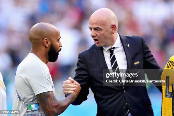 Assistant Coach of Belgium Thierry Henry shakes hands with FIFA President Gianni Infantino after the 2018 FIFA World Cup Russia 3rd Place Playoff...