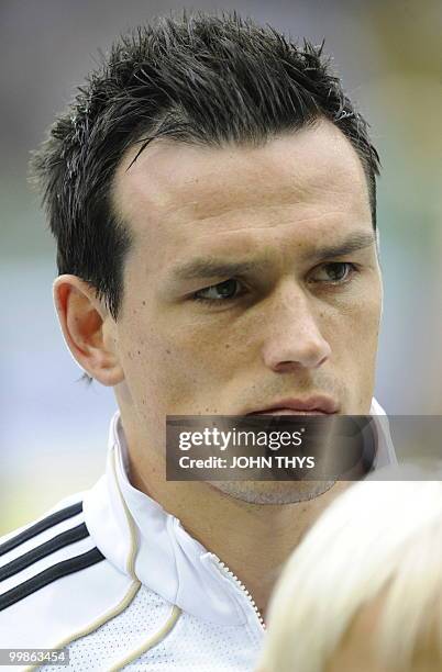 Germany's midfielder Piotr Trochowski listens to the national anthems ahead of the friendly football match Germany vs Malta in the western German...