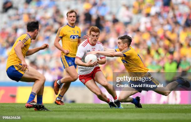 Dublin , Ireland - 14 July 2018; Peter Harte of Tyrone is tackled by Cathal Compton of Roscommon during the GAA Football All-Ireland Senior...