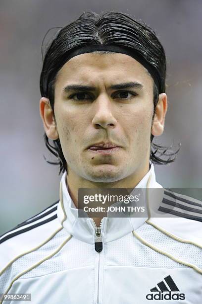 Germany's defender Serdar Tasci listens to the national anthems ahead of the friendly football match Germany vs Malta in the western German city of...
