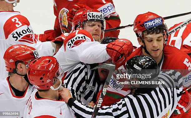 Belarus' and Denmark's players fight during the IIHF Ice Hockey World Championship match Belarus vs Denmark in the western German city of Cologne on...