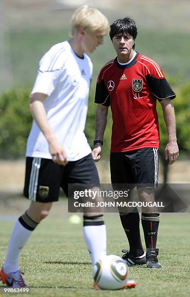 Germany's head coach Joachim Loew looks at Germany's defender Andreas Beck during a training session at the Verdura Golf and Spa resort, near Sciacca...