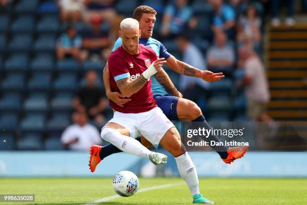 Marko Arnautovic battles for the ball with Adam El-Abd of Wycombe during the pre-season friendly match between Wycombe Wanderers and West Ham United...