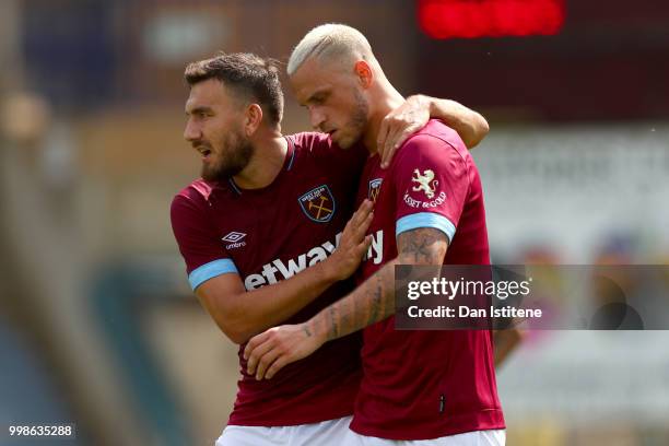 Marko Arnautovic celebrates with team-mate Robert Snodgrass of West Ham after scoring the opening goal during the pre-season friendly match between...