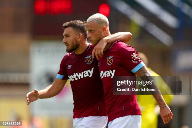 Marko Arnautovic celebrates with team-mate Robert Snodgrass of West Ham after scoring the opening goal during the pre-season friendly match between...