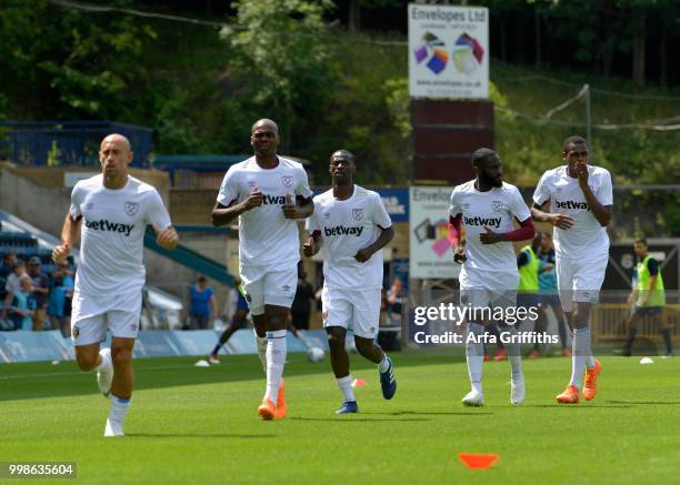 Players of West Ham United warm up before the Pre Season Friendly between Wycombe Wanderers and West Ham United at Adams Park on July 14, 2018 in...