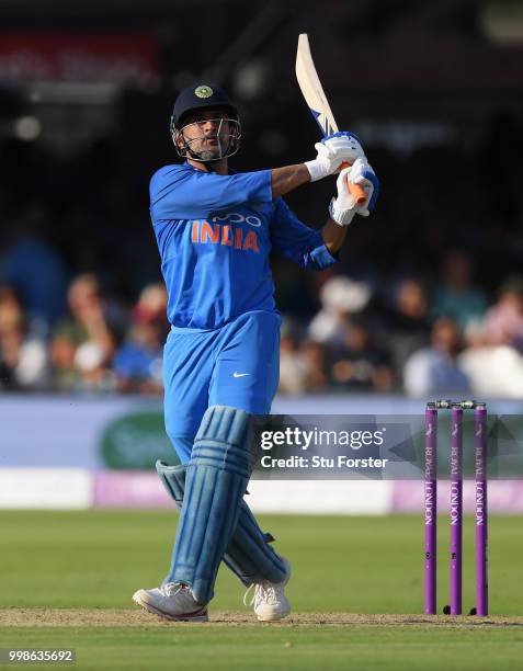 India batsman MS Dhoni hits out only to be caught on the boundary during the 2nd ODI Royal London One Day International match between England and...