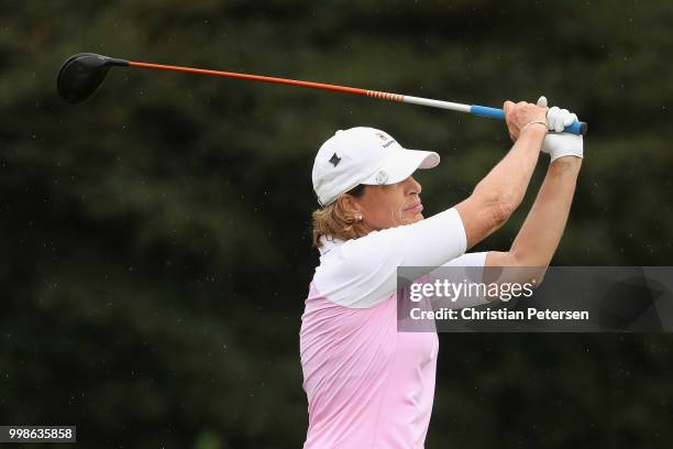 Juli Inkster plays a tee shot on the fourth hole during the third round of the U.S. Senior Women's Open at Chicago Golf Club on July 14, 2018 in...