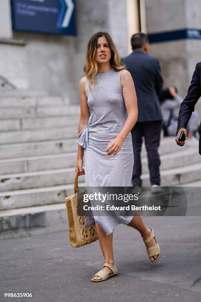 Guest wears a gray dress, beige shoes, outside Lanvin, during Paris Fashion Week - Menswear Spring-Summer 2019, on June 24, 2018 in Paris, France.
