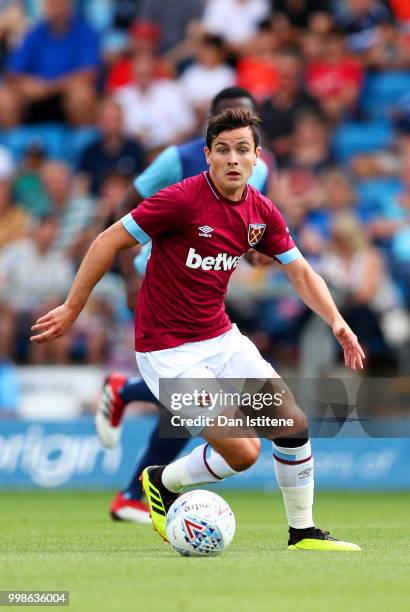 Josh Cullen of West Ham runs with the ball during the pre-season friendly match between Wycombe Wanderers and West Ham United at Adams Park on July...