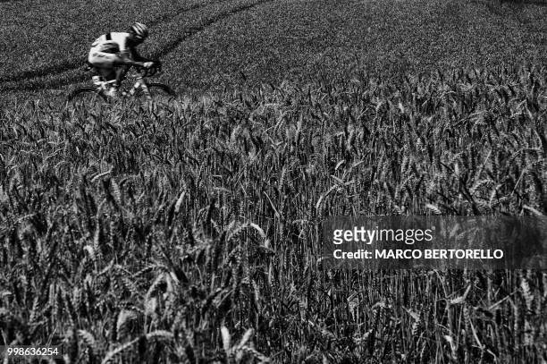 Breakaway man France's Laurent Pichon rides across wheat fields during the seventh stage of the 105th edition of the Tour de France cycling race...