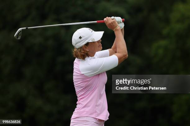 Juli Inkster plays a tee shot on the third hole during the third round of the U.S. Senior Women's Open at Chicago Golf Club on July 14, 2018 in...
