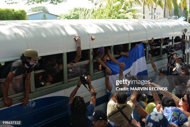 Students of the National Autonomous University of Nicaragua , who hid overnight in a church during an attack by government forces, arrive at the...