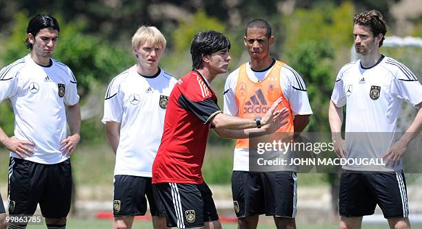 Germany's head coach Joachim Loew explains tactics to Germany's defender Serdar Tasci, Germany's defender Andreas Beck, Germany's defender Dennis...