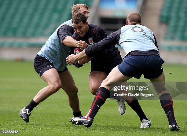 Olly Barkley moves past Chris Robshaw and Dave Attwood during an England training session held at Twickenham on May 18, 2010 in Twickenham, England.